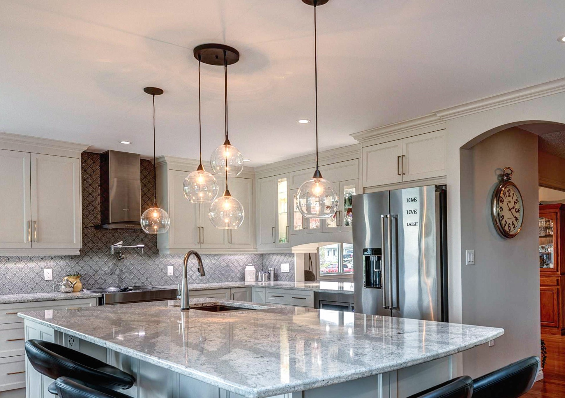 fancy lighting over kitchen peninsula